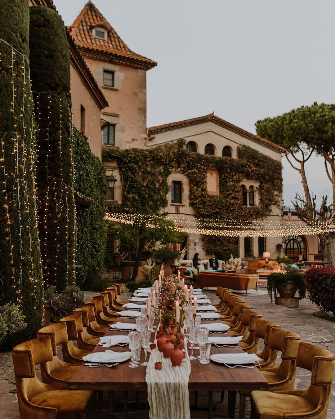 Romantic outdoor reception setup at Can Ribas de Montbui, one of the top Barcelona wedding venues with historic charm and ambient lighting.