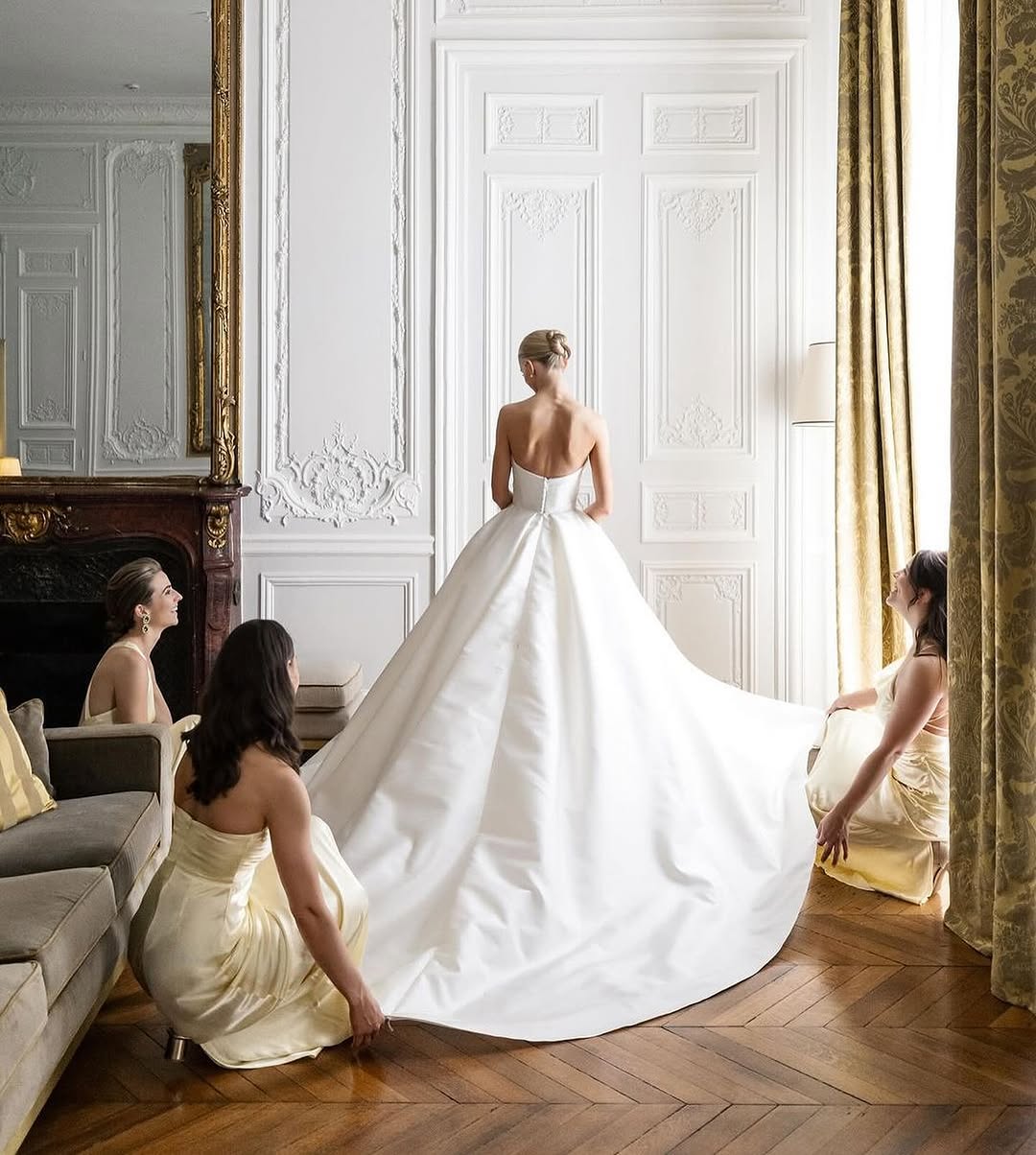 Elegant bride getting ready in a classic Parisian suite at Hôtel Alfred Sommier, a refined choice among historic Paris wedding venues.