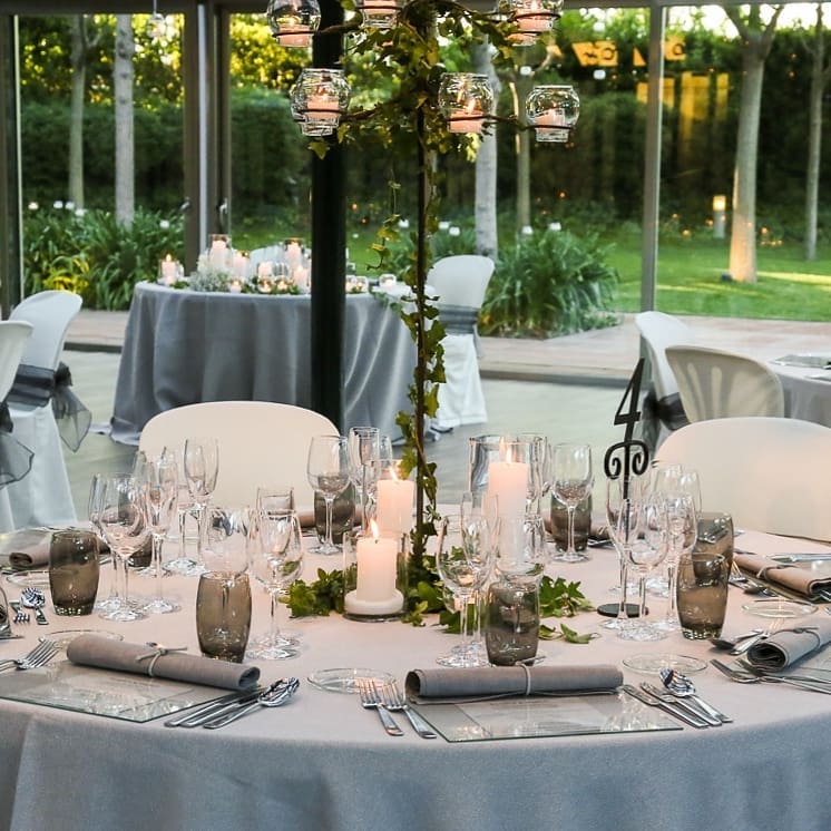 Modern indoor reception table setup at Miramar Events, a versatile and elegant location for Barcelona wedding venues.