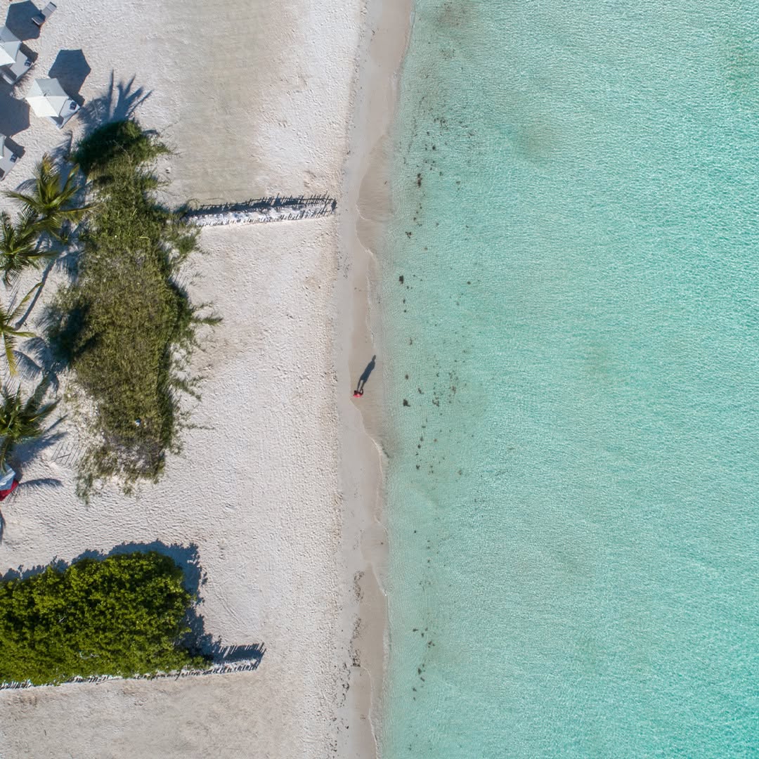 Secluded white-sand beach at Na Balam Beach Hotel, an ideal beachfront location for a serene Isla Mujeres wedding.
