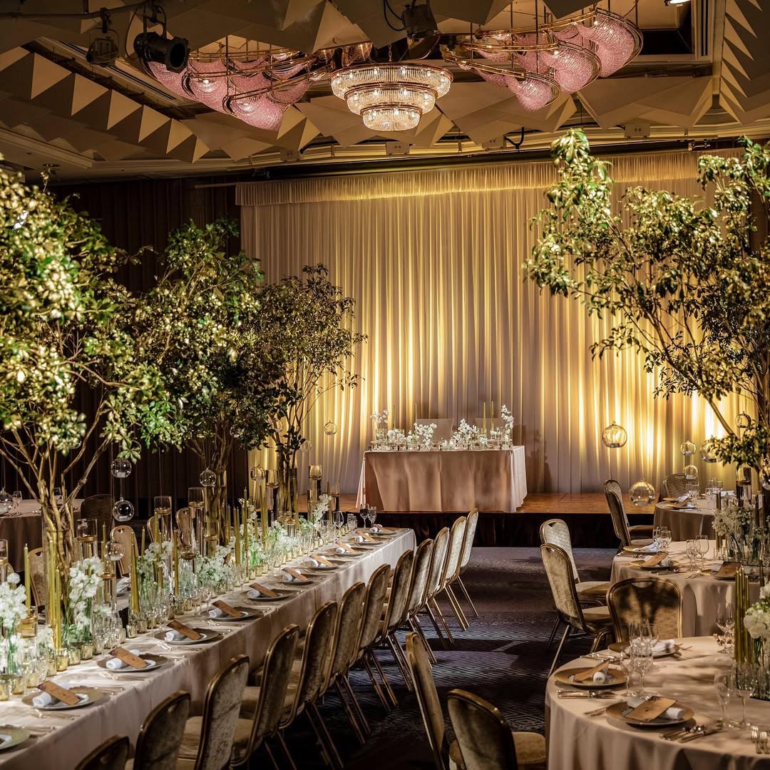 Bride and groom in a lush, green Japanese garden surrounded by trees and reflection pools at Kyoto Brighton Hotel—offering tranquil beauty among Kyoto wedding venues.